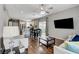 Open-concept living space with a view of the kitchen, dining area, and comfortable seating, perfect for modern living at 2613 Country Mile Dr, Las Vegas, NV 89135