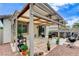 Inviting backyard patio featuring a shaded pergola, a grill, and an above-ground pool at 2613 Country Mile Dr, Las Vegas, NV 89135