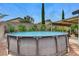 Backyard above-ground pool on a sunny day, perfect for cooling off and relaxing during the summer at 2613 Country Mile Dr, Las Vegas, NV 89135