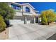 Inviting home exterior boasting a three-car garage and a beautifully landscaped front yard at 2726 Manteno Ct, Henderson, NV 89052