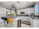 Bright kitchen features white cabinetry, stainless steel appliances, and granite countertops at 2726 Manteno Ct, Henderson, NV 89052