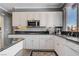 Bright kitchen with white cabinetry, stainless steel appliances, and granite countertops at 2726 Manteno Ct, Henderson, NV 89052