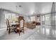 Elegant living and dining areas with tile flooring, neutral decor, and ample natural light at 2726 Manteno Ct, Henderson, NV 89052
