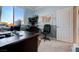 Home office with large window, desk, chair, and wall map at 2726 Manteno Ct, Henderson, NV 89052