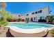 Backyard view showcases a sparkling pool, lush landscaping, and a well-maintained two-story house at 2726 Manteno Ct, Henderson, NV 89052