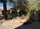 Backyard featuring lush landscaping, stone accents, and a serene garden setting at 2796 Cape Hope Way, Las Vegas, NV 89121