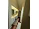 Bathroom with dual sinks, granite counters, updated cabinets, and an oversized mirror at 2796 Cape Hope Way, Las Vegas, NV 89121
