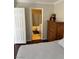 Bedroom view leading to bathroom, with hardwood floors and neutral decor at 2796 Cape Hope Way, Las Vegas, NV 89121