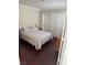 Cozy bedroom featuring hardwood floors, neutral walls, and a comfortable bed at 2796 Cape Hope Way, Las Vegas, NV 89121