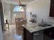 Eat-in kitchen with granite countertops, updated appliances and custom stained-glass window at 2796 Cape Hope Way, Las Vegas, NV 89121