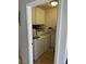 Functional laundry room with washer, dryer, and overhead storage at 2796 Cape Hope Way, Las Vegas, NV 89121