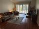 Inviting living room featuring a fireplace, and sliding glass doors for natural light at 2796 Cape Hope Way, Las Vegas, NV 89121