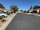 Street view of community featuring well-maintained landscaping and street parking at 2796 Cape Hope Way, Las Vegas, NV 89121