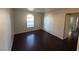 Bedroom featuring dark wood floors, a window, and neutral paint tones at 2966 Juniper Hills Blvd # 102, Las Vegas, NV 89142