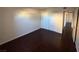 Empty bedroom with dark wood-look floors and a spacious closet at 2966 Juniper Hills Blvd # 102, Las Vegas, NV 89142