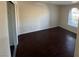 Inviting bedroom with dark wood-look floors and ample natural light at 2966 Juniper Hills Blvd # 102, Las Vegas, NV 89142