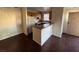 Eat-in kitchen with white appliances and breakfast bar at 2966 Juniper Hills Blvd # 102, Las Vegas, NV 89142