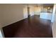 Spacious living room featuring dark wood floors and neutral paint tones at 2966 Juniper Hills Blvd # 102, Las Vegas, NV 89142