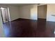 Spacious living room featuring gleaming wood floors, ample natural light, and a neutral color palette at 2966 Juniper Hills Blvd # 102, Las Vegas, NV 89142