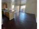 Inviting living room with dark wood floors and sliding glass door to the outside at 2966 Juniper Hills Blvd # 102, Las Vegas, NV 89142