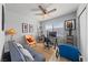 Bedroom/office area with a futon, workspace, natural light, and hardwood floors at 320 Shadybrook Ln # D, Las Vegas, NV 89107