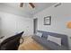 Cozy bedroom featuring a sofa, hardwood floors, and closet space at 320 Shadybrook Ln # D, Las Vegas, NV 89107