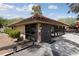 Exterior daytime view of a community clubhouse featuring many windows, door, and covered entry at 320 Shadybrook Ln # D, Las Vegas, NV 89107