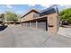 Exterior view of property featuring private garages at 320 Shadybrook Ln # D, Las Vegas, NV 89107