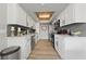 Modern kitchen features stainless appliances, white cabinetry and grey subway tile backsplash at 320 Shadybrook Ln # D, Las Vegas, NV 89107