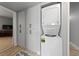 Convenient laundry room equipped with a stacked washer and dryer unit, and ample storage at 320 Shadybrook Ln # D, Las Vegas, NV 89107