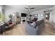 Inviting living room with a ceiling fan, fireplace, contemporary decor, and hardwood floors at 320 Shadybrook Ln # D, Las Vegas, NV 89107