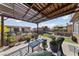 Rooftop patio with a pergola and comfortable seating arrangements, perfect for enjoying the outdoors at 320 Shadybrook Ln # D, Las Vegas, NV 89107