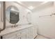 Bathroom featuring a double sink vanity with white cabinets and marble countertops at 3287 Southridge Ave, Las Vegas, NV 89121