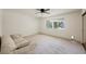 This bedroom offers a fan, carpet, and outdoor views, creating a serene ambiance at 3287 Southridge Ave, Las Vegas, NV 89121