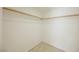 Walk-in closet with carpet flooring and wooden hanging rods at 3287 Southridge Ave, Las Vegas, NV 89121