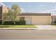 Street view of a home with a landscaped front yard, a driveway, and an attached garage at 3287 Southridge Ave, Las Vegas, NV 89121