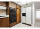 Kitchen featuring white countertops, gas stove, oven, and a white refrigerator at 3287 Southridge Ave, Las Vegas, NV 89121