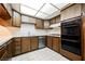 Kitchen features wood cabinets, white countertops, and a stainless steel dishwasher with oven at 3287 Southridge Ave, Las Vegas, NV 89121