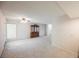 The living area features neutral wallpaper and patterned carpeting, highlighted by a vintage china cabinet at 3287 Southridge Ave, Las Vegas, NV 89121