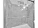 Shower featuring elegant marble tile with glass doors and sleek fixtures, at 3929 Torsby Pl # 3929, Las Vegas, NV 89119