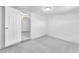 A simple bedroom with gray carpet and white walls is ready for your personal touches at 3929 Torsby Pl # 3929, Las Vegas, NV 89119