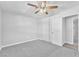 Bedroom with ceiling fan, closet, and doorway to hall and other rooms at 3929 Torsby Pl # 3929, Las Vegas, NV 89119