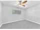 Cozy bedroom with a ceiling fan, and natural light from the large window at 3929 Torsby Pl # 3929, Las Vegas, NV 89119