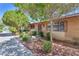 Charming single story home featuring brick and lush landscaping at 3929 Torsby Pl # 3929, Las Vegas, NV 89119