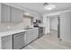 Updated kitchen with stainless steel appliances and light gray cabinets at 3929 Torsby Pl # 3929, Las Vegas, NV 89119