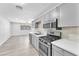 Updated kitchen with stainless steel appliances and light gray cabinets at 3929 Torsby Pl # 3929, Las Vegas, NV 89119