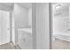 Laundry room with stacked washer and dryer and access to bath area at 3929 Torsby Pl # 3929, Las Vegas, NV 89119