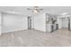 Bright living room with adjoining kitchen and light gray wood flooring at 3929 Torsby Pl # 3929, Las Vegas, NV 89119