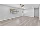 Bright living room with ceiling fan and light gray wood flooring at 3929 Torsby Pl # 3929, Las Vegas, NV 89119