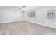 Bright living room with ceiling fan and light gray wood flooring at 3929 Torsby Pl # 3929, Las Vegas, NV 89119